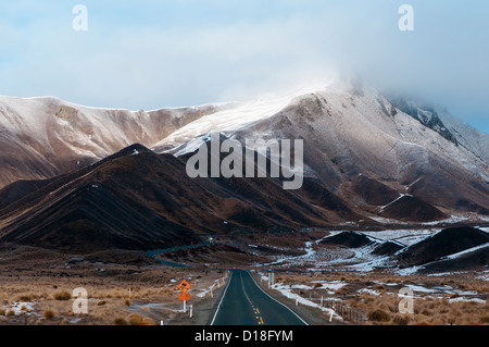 Paved mountain pass in rural landscape