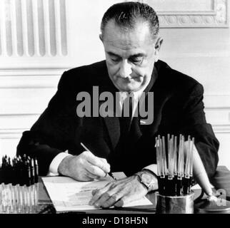 Money for the Vietnam War. President Lyndon Johnson signs the special $700 billion appropriation to fight the war in Vietnam. Stock Photo