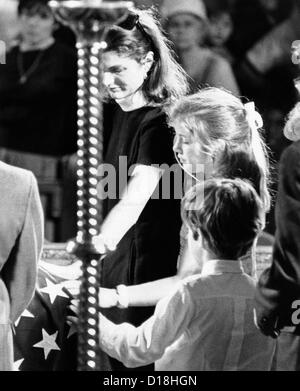 Jacqueline Kennedy and her children at Robert Kennedy's funeral. The former First Lady, Caroline and John Jr. touch the Stock Photo