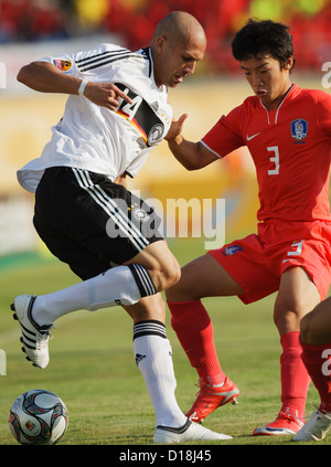 SUEZ, EGYPT - SEPTEMBER 29:  Dani Schahin of Germany (L) changes direction on Min Woo Kim of South Korea (R) during the 2009 FIFA U-20 World Cup Group C match at Mubarak Stadium on September 29, 2009 in Suez, Egypt. Editorial use only. Commercial use prohibited. (Photograph by Jonathan Paul Larsen / Diadem Images) Stock Photo