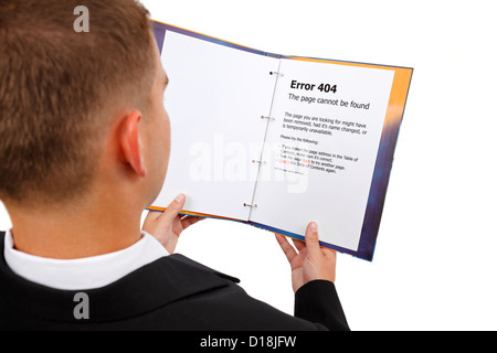Man looking at book, error 404 page displayed. Metaphoric view of a missing document Stock Photo