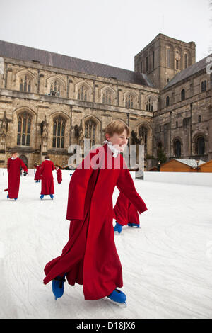 Winchester Cathedral, Hampshire, England, UK.11.12.2012 Picture shows Boy Choristers of Winchester Cathedral skating on the cathedral's ice rink, as part of the annual celebrations running up to Christmas. Stock Photo