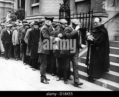 Breadline for the needy, probably in New York City. A Priest hands out coins. Ca. Nov 4, 1930. (CSU ALPHA 1398) CSU Stock Photo