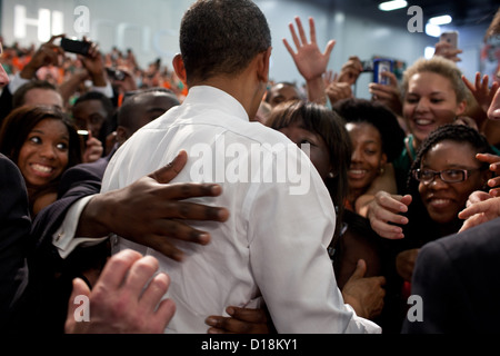 President Barack Obama greets audience members after delivering remarks on the economy at the University of Miami Field House Stock Photo