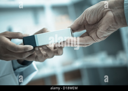 Medicine pack being handed to someone Stock Photo