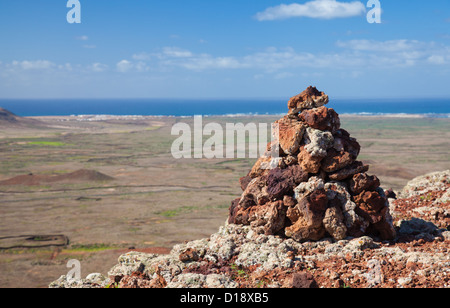 red volcanic rock cairn on the edge of Calderon Hondo, Northern Fuerteventura Stock Photo