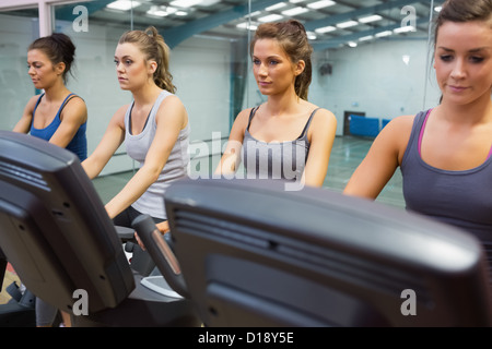 Four women at spinning class Stock Photo