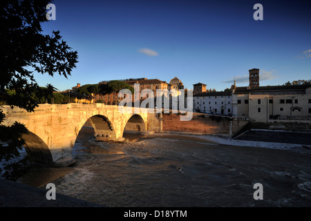 Italy, Rome, Tiber river, Cestius bridge and Isola Tiberina at dawn Stock Photo