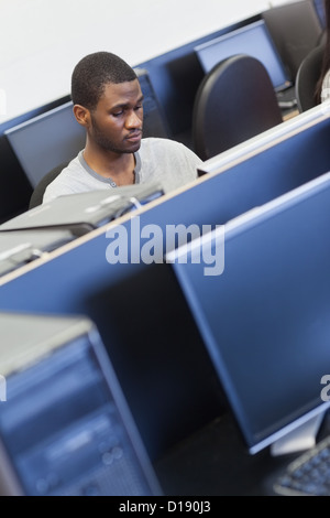 Man sitting in the computer room Stock Photo