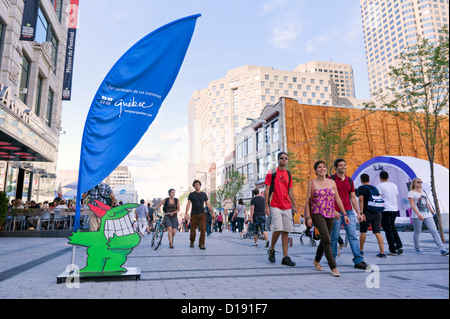 Pedestrians on a part Ste Catherine street which is closed to ...