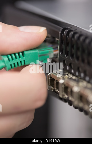 Hand plugging in USB Stock Photo