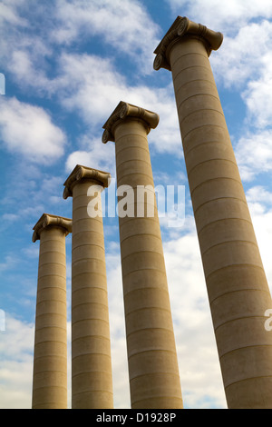 Four massive columns, blue sky Stock Photo