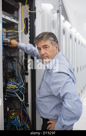 Technician working on data servers Stock Photo