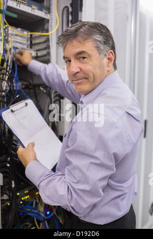 Data center worker checking the servers Stock Photo