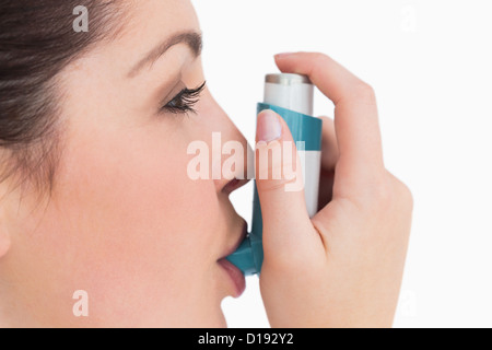 Woman with an asthma inhaler Stock Photo