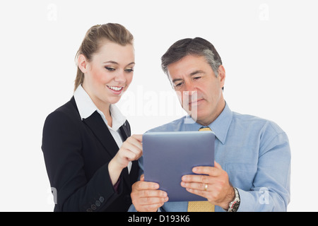 Business people using a tablet together Stock Photo - Alamy