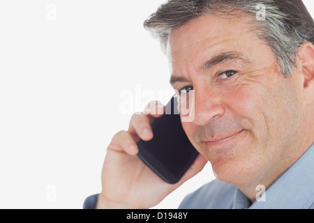 Mature businessman using cell phone Stock Photo