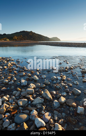 The River Char at Charmouth Beach with Golden Cap in the Distance. Jurassic Coast World Heritage Site. Dorset. England. UK. Stock Photo