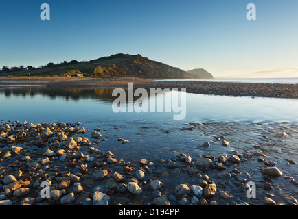 The River Char at Charmouth Beach with Golden Cap in the Distance. Jurassic Coast World Heritage Site. Dorset. England. UK. Stock Photo