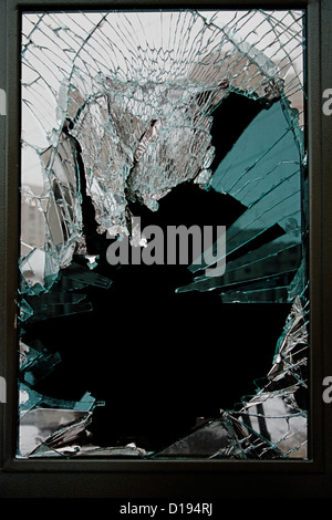 Broken glass door of the shop Stock Photo