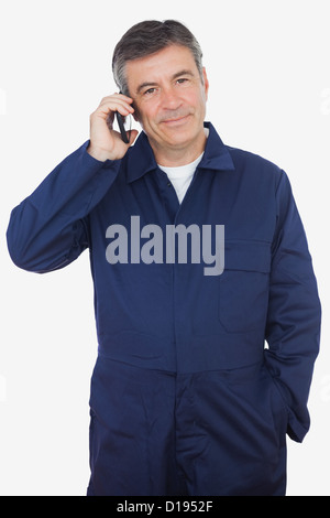 Mechanic using cell phone Stock Photo