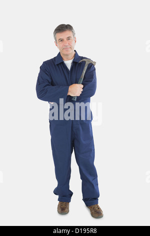 Confident mechanic holding hammer Stock Photo