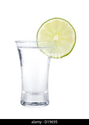 Shot of vodka and lime slice. Isolated on white background Stock Photo