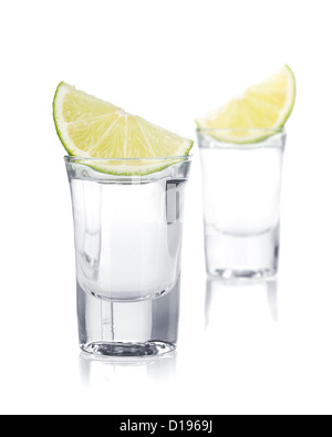 Two shots of vodka and lime slice. Isolated on white background Stock Photo