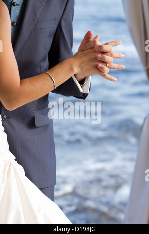 First wedding dance with crystal blue sea on the background Stock Photo