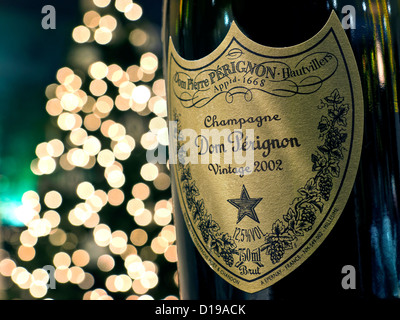 Bottle of 2002 Dom Perignon luxury vintage champagne with sparkling lights in background Stock Photo