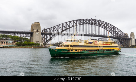 Ferry passing Sydney Harbour Bridge Stock Photo
