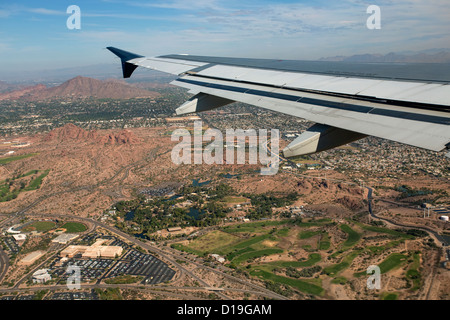 Aerial aircraft wing Phoenix Arizona golf course city. Stock Photo