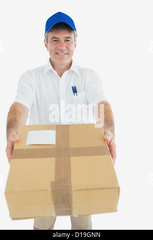 Happy delivery man giving package Stock Photo