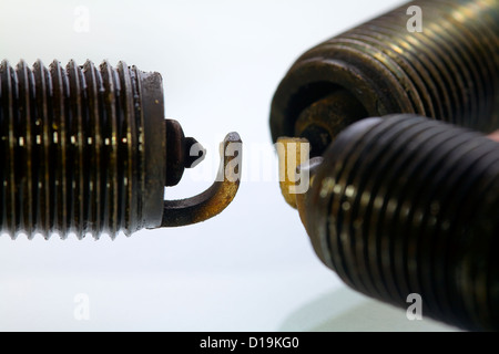 Close up of a old spark plugs with carbon deposit isolated on white background Stock Photo