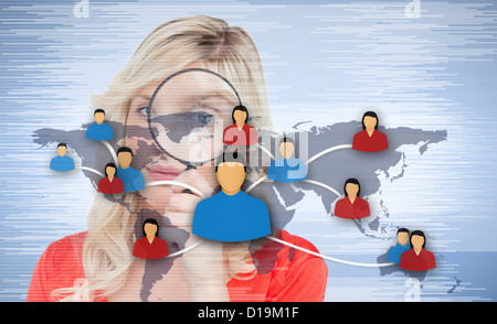 Woman with magnifier standing in background Stock Photo