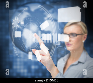 Businesswoman using touch screen Stock Photo