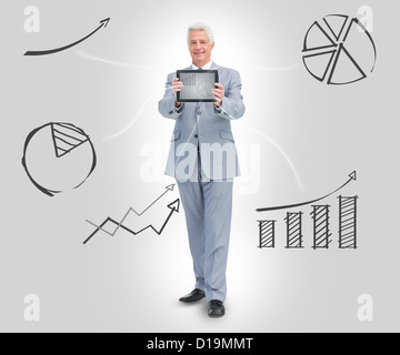 Businessman holding tablet Stock Photo