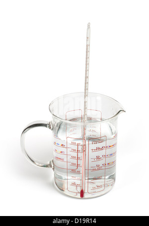 Thermometer measures the temperature of the water in beaker with scale. Stock Photo