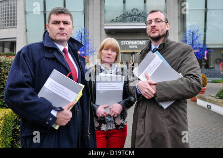 12th December 2012 - Belfast, Northern Ireland. Mark Thompson (Relatives for Justice), Theresa Sloan (widow of Gerard Sloan) and Paul Pierce (Kevin R. Winters & Co) receive their copies of the report by The Rt Hon sir Desmond de Silva into the death of Belfast solicitor Patrick (Pat) Finucane. Credit:  Stephen Barnes / Alamy Live News Stock Photo