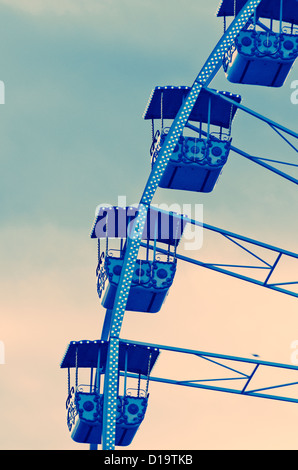 Detail of the cabin of The famous giant christmas's wheel, operating from december till the end of carnival period in place masssena  in Nice, Cote Azur, France. retro and surrealistic  post processing used to increase the mood of the composition Stock Photo