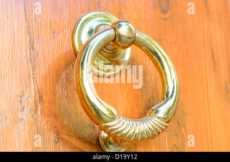 A Round Golden Lever from a luxurious door Stock Photo