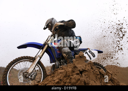 Motocross biker tackles a jump in the notorious annual Weston Beach Race held in Weston-super-Mare, UK Stock Photo