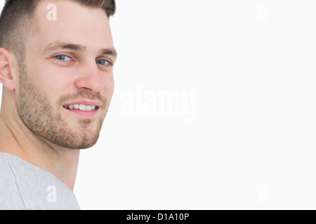 Side view portrait of smiling young man Stock Photo