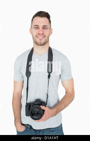 Portrait of male photographer with photographic camera Stock Photo
