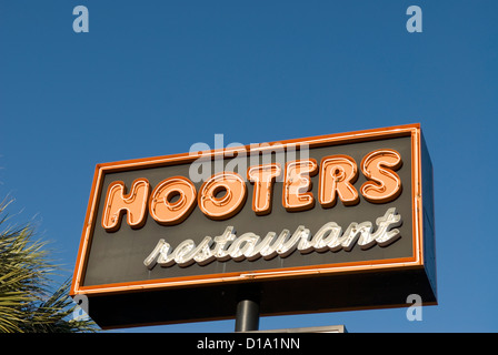 Hooters restaurant sign against blue sky, United States. Stock Photo