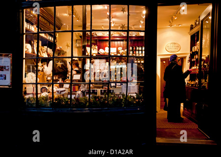 Little Bettys shop store window at night evening Christmas Stonegate York North Yorkshire England UK United Kingdom GB Great Britain Stock Photo