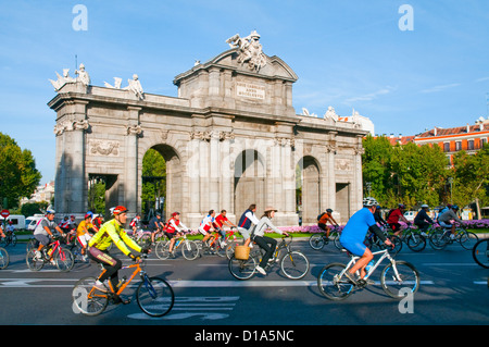 People riding bike in the Bike Party. Alcala Gate, Madrid, Spain. Stock Photo