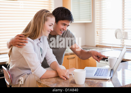Young couple looking laptop screen Stock Photo
