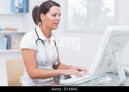 Female doctor using computer at clinic Stock Photo