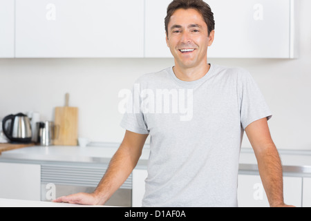 Smiling man in kitchen Stock Photo